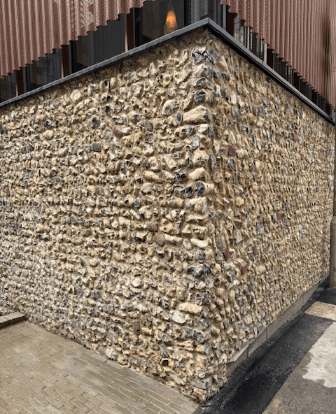 The coursed field flint on this Regency Brighton Hotel extension shows flint being used on the corner.